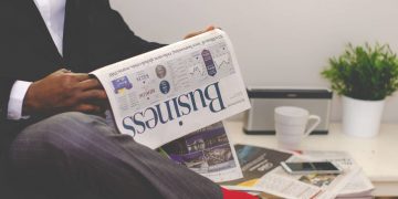 Photo by nappy from Pexels: https://www.pexels.com/photo/man-reading-newspaper-while-sitting-near-table-with-smartphone-and-cup-935979/