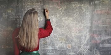Photo by Andrea Piacquadio: https://www.pexels.com/photo/woman-in-red-long-sleeve-writing-on-chalk-board-3769714/