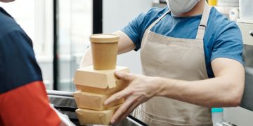Photo by Norma Mortenson: https://www.pexels.com/photo/man-wearing-a-face-mask-putting-food-on-a-thermal-bag-4393667/