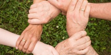 Photo by Pixabay: https://www.pexels.com/photo/group-of-people-holding-arms-461049/