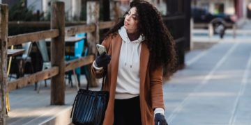 Photo by Tim Douglas : https://www.pexels.com/photo/attentive-female-carrying-shopping-bags-while-walking-with-smartphone-6567663/